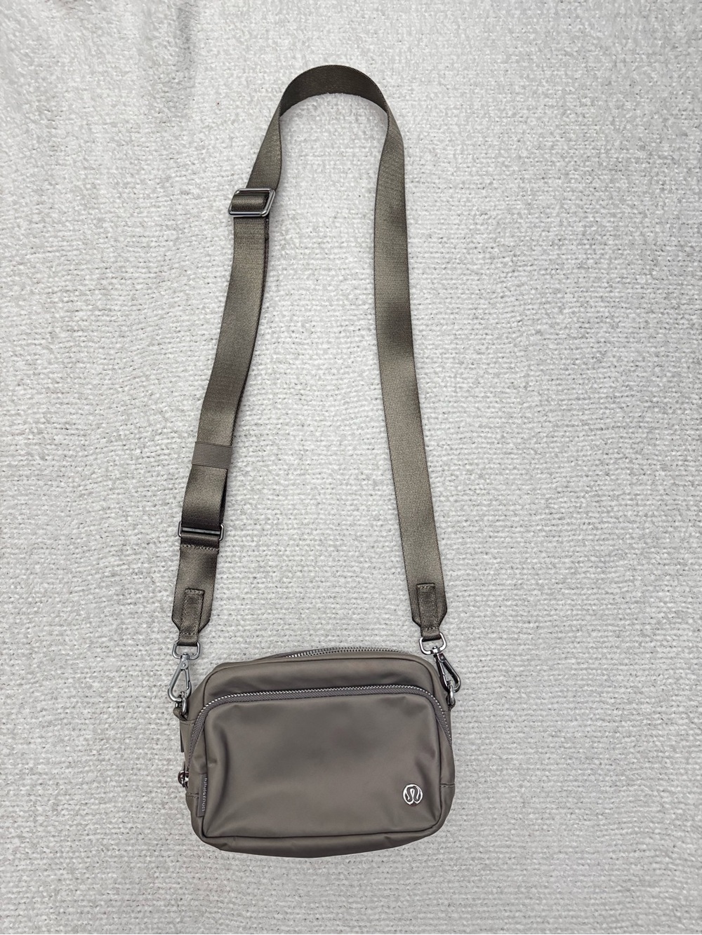 lululemon Everywhere Crossbody Bag 2L Metal Hardware in the color Warm Ash Grey.